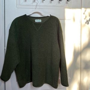 Green sweater.